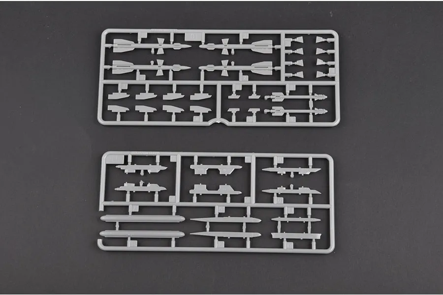 Two grey plastic model kit sprues containing various missile and weapon parts for a 1/72 scale aircraft model.