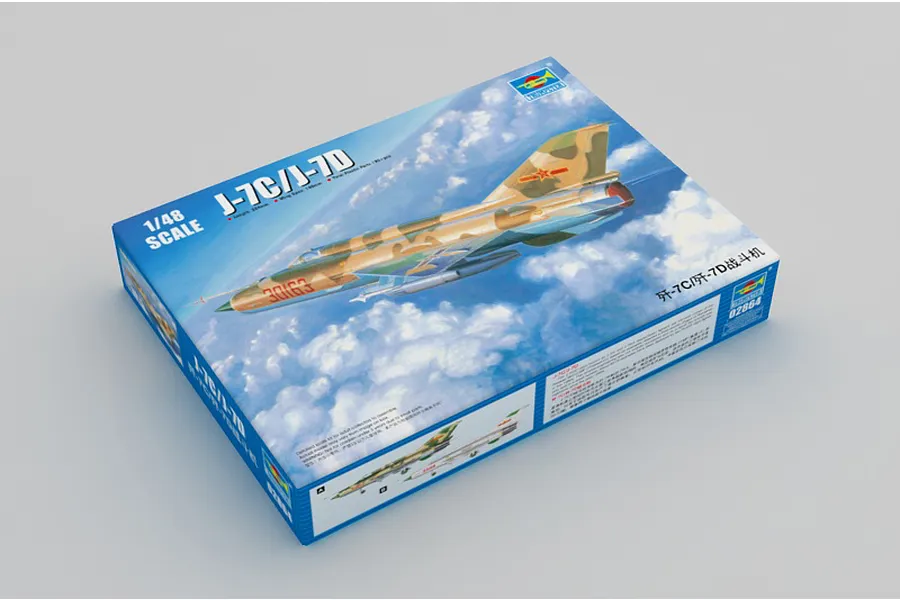 Trumpeter 1/48 scale J-7C/J-7D jet model kit box featuring artwork of a camouflaged fighter jet flying above clouds.