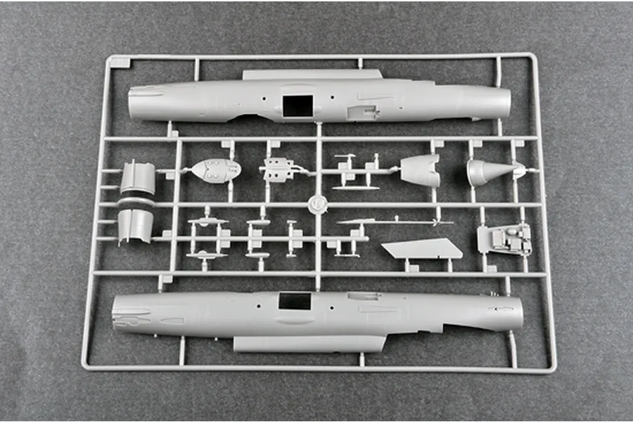 A grey plastic sprue from a Trumpeter 1/48 scale model kit featuring two large fuselage halves and various smaller aircraft components.
