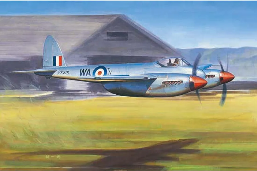 An artistic illustration of a silver De Havilland Hornet fighter aircraft flying low over a grassy field in front of a hangar.