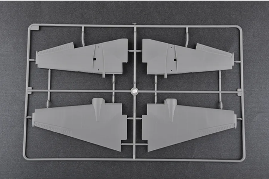 A grey plastic model kit sprue containing four aircraft wing sections for a 1/48 scale model.