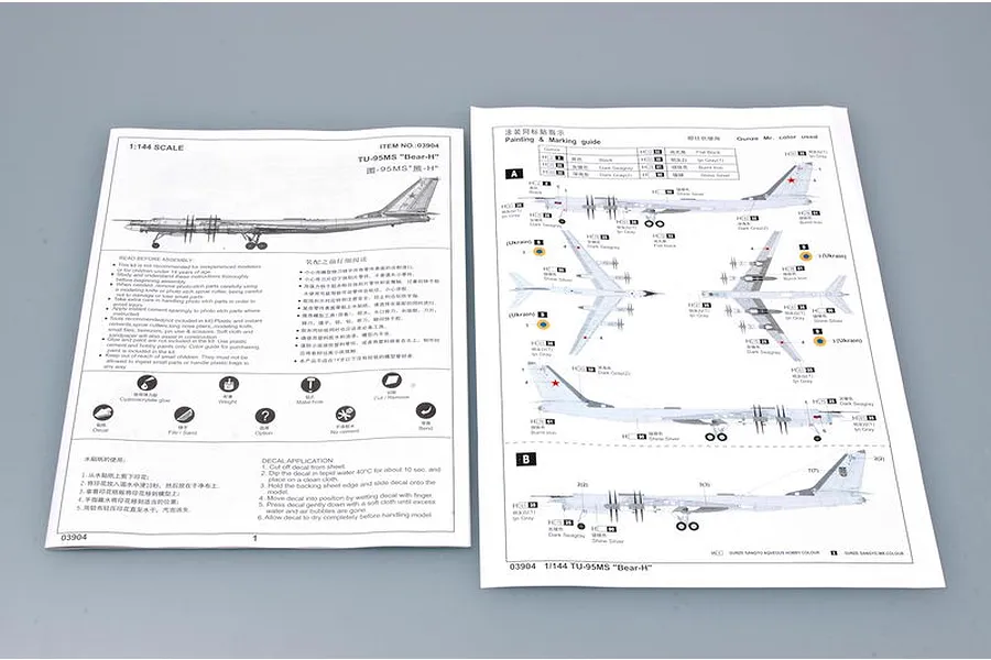 Instruction manual pages for the Trumpeter 1/144 TU-95MS Bear-H Bomber plastic model kit, showing assembly steps and painting guides.