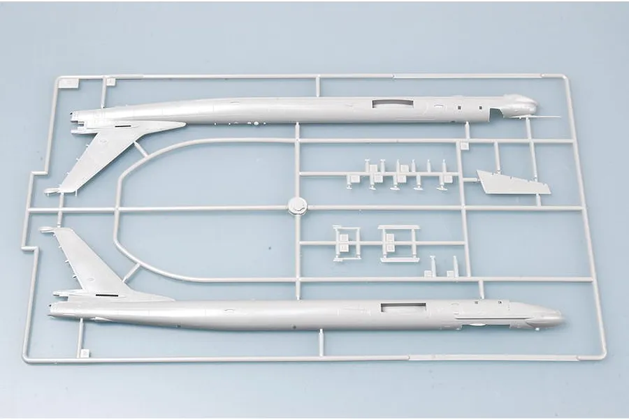 A grey plastic model kit sprue containing the two fuselage halves for a 1/144 scale TU-95MS bomber model.