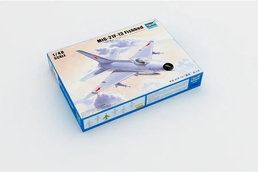 Trumpeter 1/48 scale MiG-21F-13 Fishbed plastic model kit box, featuring artwork of the jet in flight against a cloudy sky.