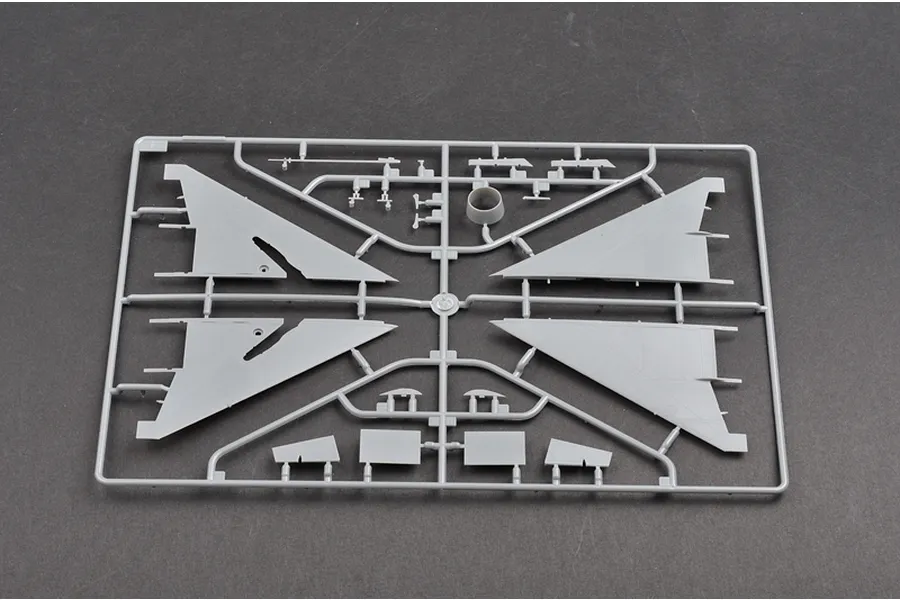 A grey plastic sprue from a 1/48 scale Trumpeter MiG-21F-13 model kit, showing aircraft wing and control surface parts.