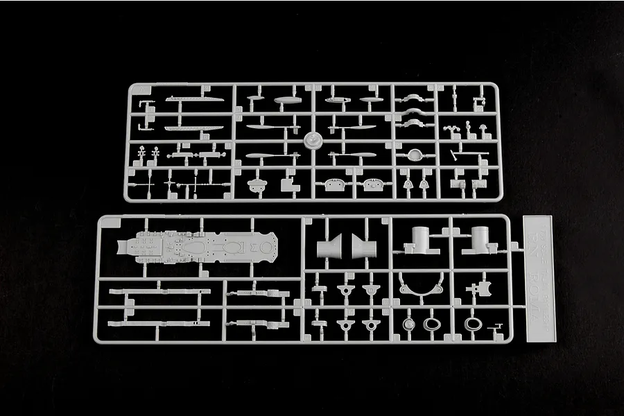 Two grey plastic model kit sprues for a 1/700 scale Italian RN Roma battleship, featuring various ship components like deck sections and turrets.