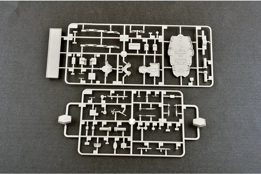 Two grey plastic model kit sprues containing various ship parts for a 1/700 scale battleship model.