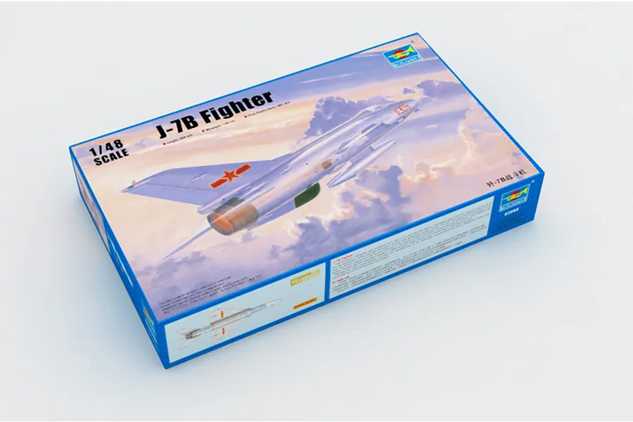 A Trumpeter 1/48 scale J-7B Fighter jet plastic model kit box, featuring an illustration of the aircraft in flight against a cloudy sky.