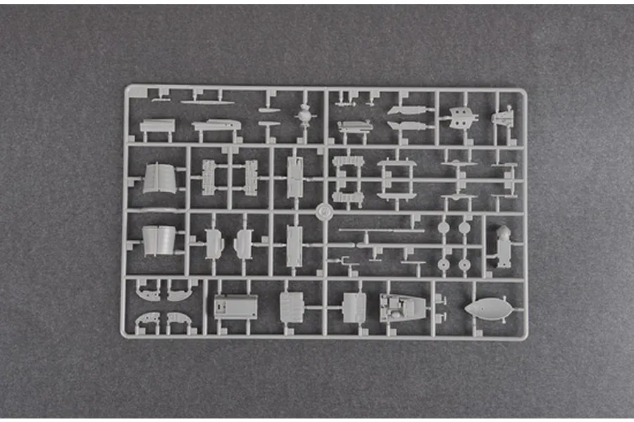 A grey plastic sprue containing various unpainted model aircraft parts for a 1/48 scale J-7B fighter jet kit.