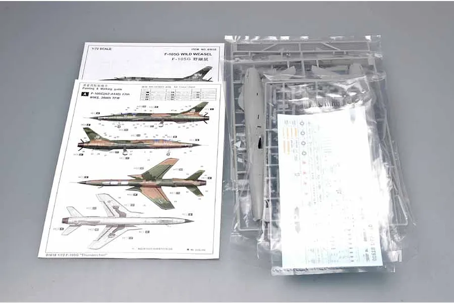 Trumpeter 1/72 F-105G Wild Weasel model kit contents including instruction manual, decal sheet, and plastic sprues in sealed bags.