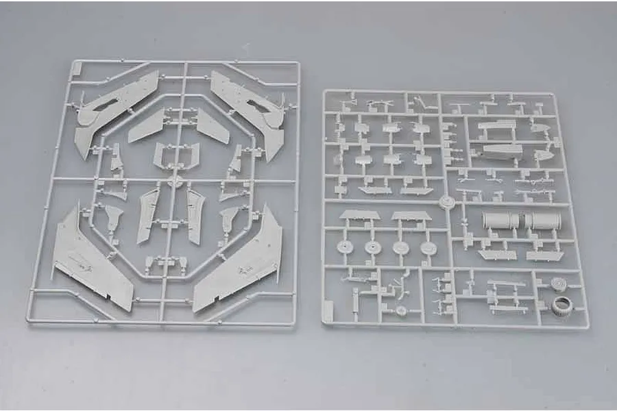 Two grey plastic model kit sprues containing various aircraft parts for an F-105G Wild Weasel model, laid out on a plain light grey background.