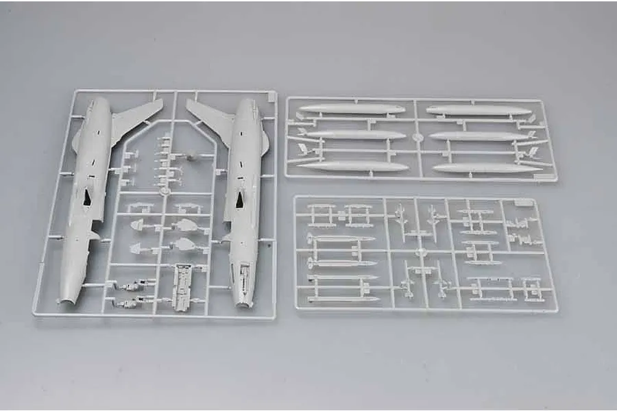 Three grey plastic model kit sprues for a 1/72 scale F-105G Wild Weasel aircraft, showing fuselage halves, missiles, and external fuel tanks.