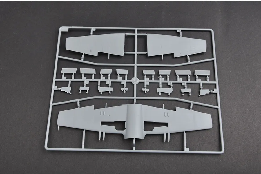 A grey plastic sprue containing model aircraft wing and control surface parts for a 1/48 scale model kit.
