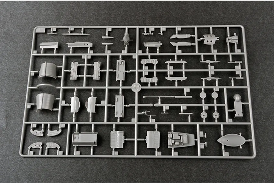 A grey plastic sprue containing various unpainted model aircraft parts for a 1/48 scale J-7A fighter jet kit.
