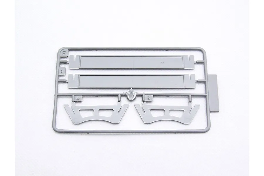 A grey plastic sprue from a Trumpeter 1/700 scale model kit containing two long rectangular parts and two curved structural components.
