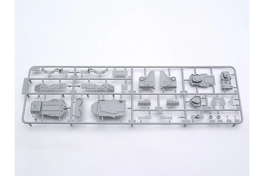 A grey plastic sprue containing various small model parts for a 1/700 scale battleship model kit, viewed from above against a white background.