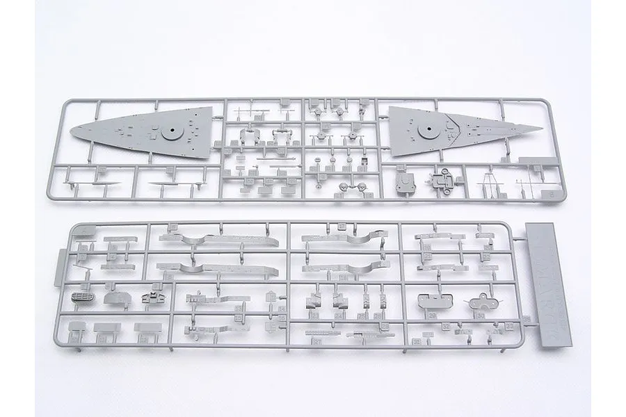 Two grey plastic model kit sprues containing various ship parts for a 1/700 scale Bismarck battleship model.