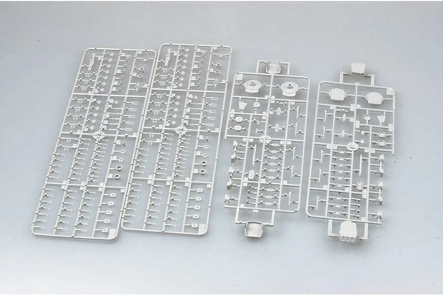 Four grey plastic model kit sprues containing various small parts for a 1/700 scale battleship model.