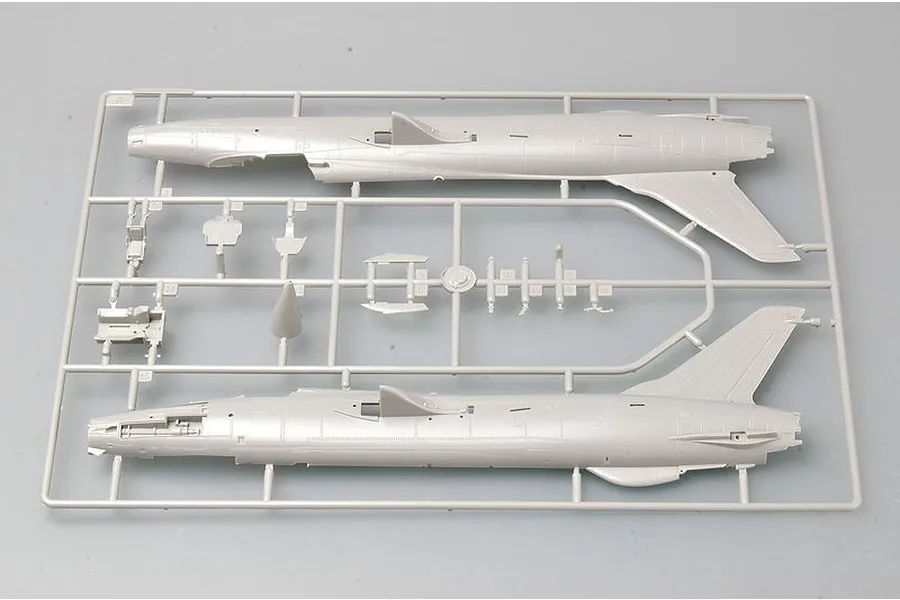 A grey plastic model kit sprue containing fuselage halves and cockpit components for a 1/72 scale F-105 Thunderchief model.