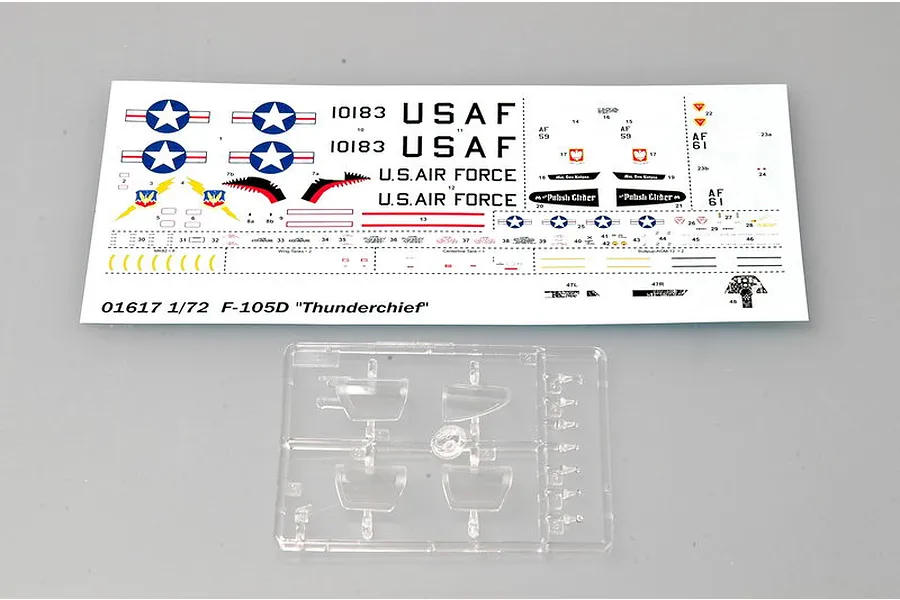 A decal sheet and a clear plastic sprue for a 1/72 scale Trumpeter F-105D Thunderchief model kit.
