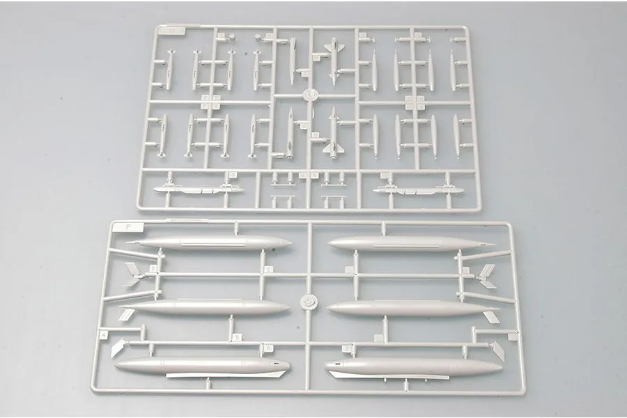Two grey plastic model kit sprues containing various aircraft weapons and external fuel tanks for a 1/72 scale F-105D Thunderchief model.