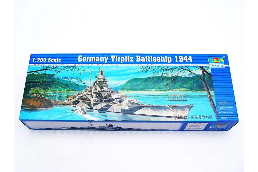Trumpeter 1/700 scale German Tirpitz 1944 battleship plastic model kit box showing box art of the ship in a fjord.