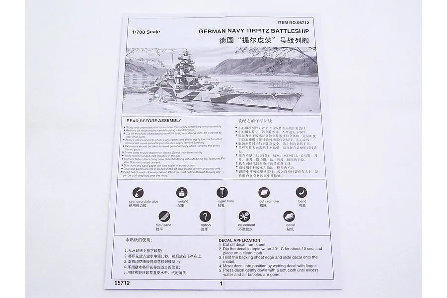 Instruction manual for the Trumpeter 1/700 scale German Navy Tirpitz battleship model kit, showing assembly guidelines and icons.