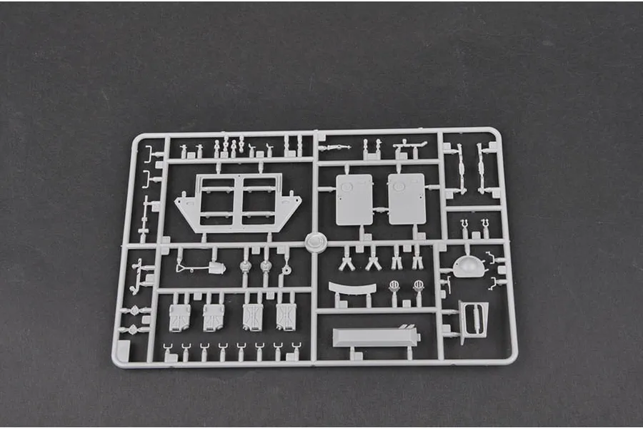 A grey plastic sprue containing various unpainted model parts for the Trumpeter 1/35 Canadian Grizzly AVGP kit.