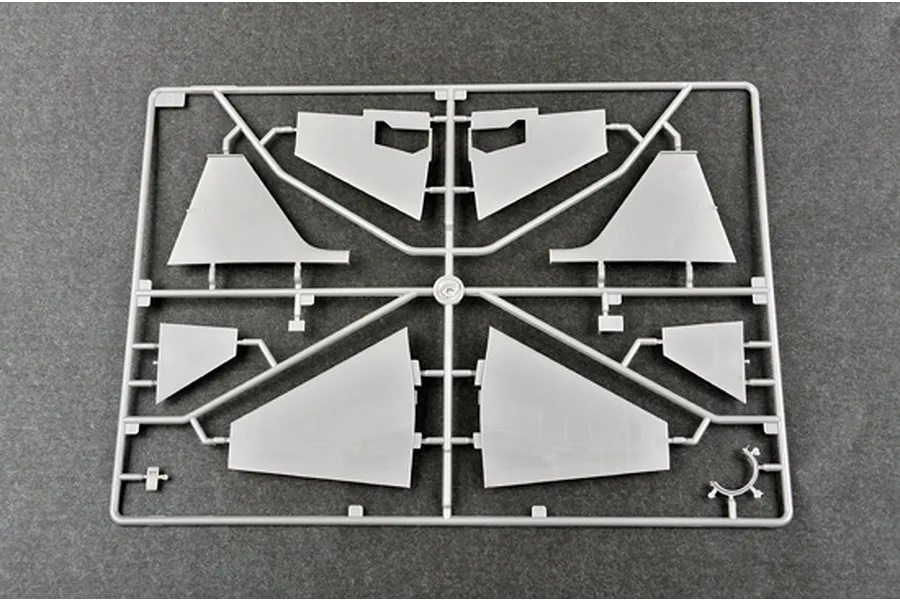 A grey plastic sprue from a Trumpeter 1/48 scale model kit containing various aircraft wing and tail components.