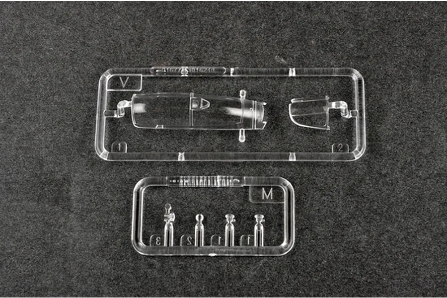 Clear plastic sprue frames containing canopy and small cockpit parts for a 1/72 scale model aircraft kit.