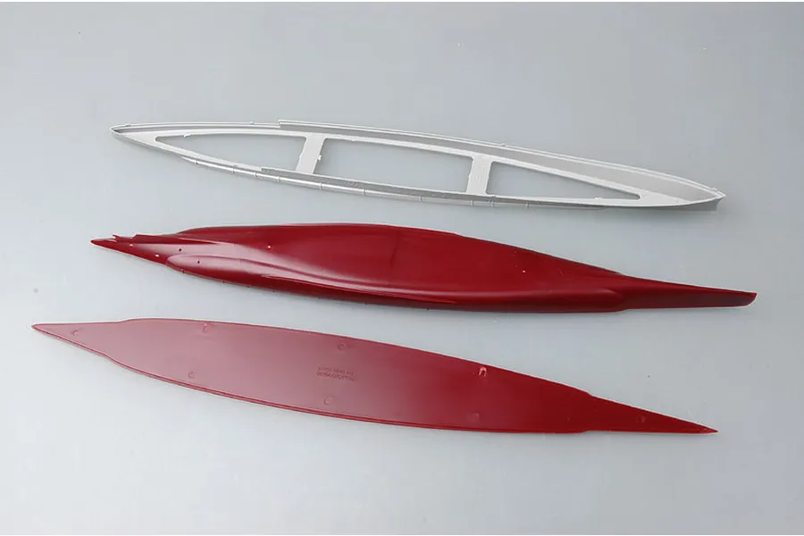Plastic model kit parts for a 1/700 scale HMS Renown ship, including a grey hull frame and two red hull pieces on a grey background.