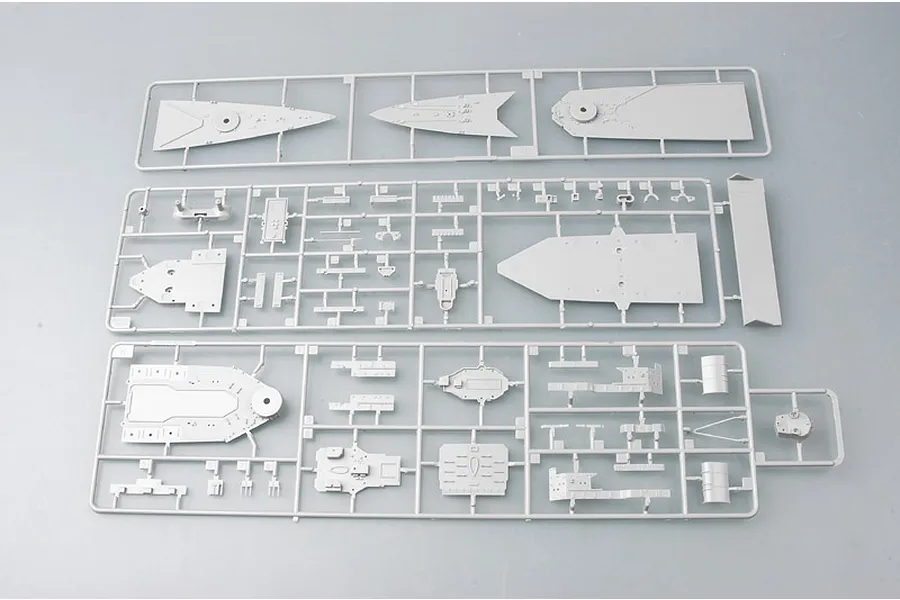 Three grey plastic model kit sprues containing various ship deck and superstructure parts for a 1/700 scale model.