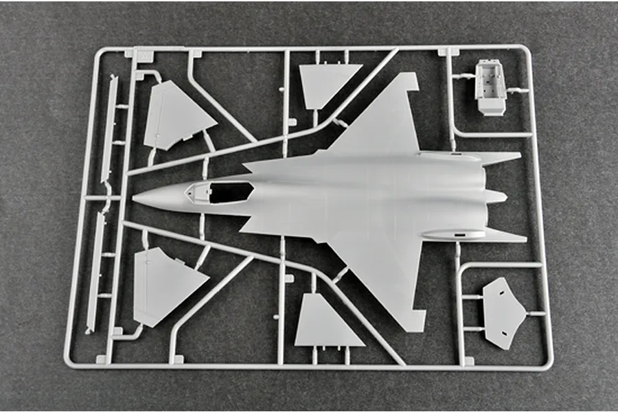 A grey plastic model kit sprue featuring the fuselage and wing components of a Shenyang J-31 fighter jet.