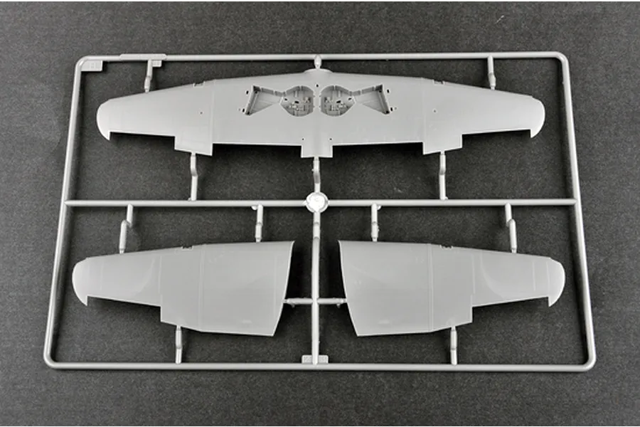 A grey plastic sprue containing aircraft wing components for a 1/48 scale model kit, viewed from above against a dark grey background.