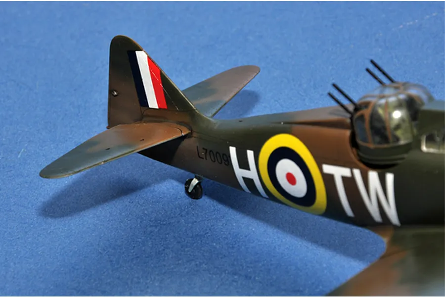 A close-up view of the rear fuselage and tail section of a Boulton Paul Defiant scale model aircraft featuring RAF markings and a gun turret.