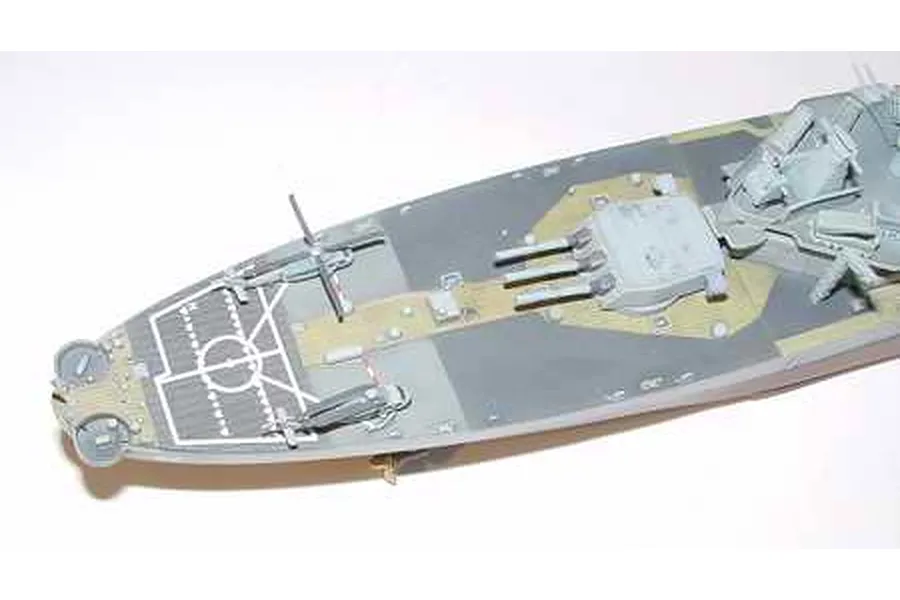A high-angle view of the stern section of a 1/700 scale USS Missouri battleship model, showing the helicopter deck, turrets, and painted deck details.