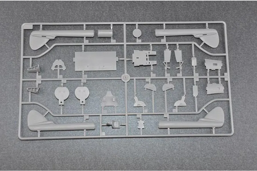 A grey plastic sprue containing various model aircraft parts for a Trumpeter 1/48 scale Vampire FB.MK.5 model kit.