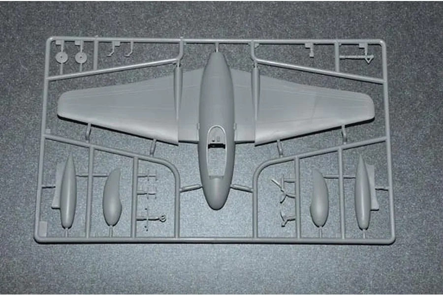 A grey plastic model kit sprue containing the main fuselage and wing assembly for a 1/48 scale Vampire jet model.