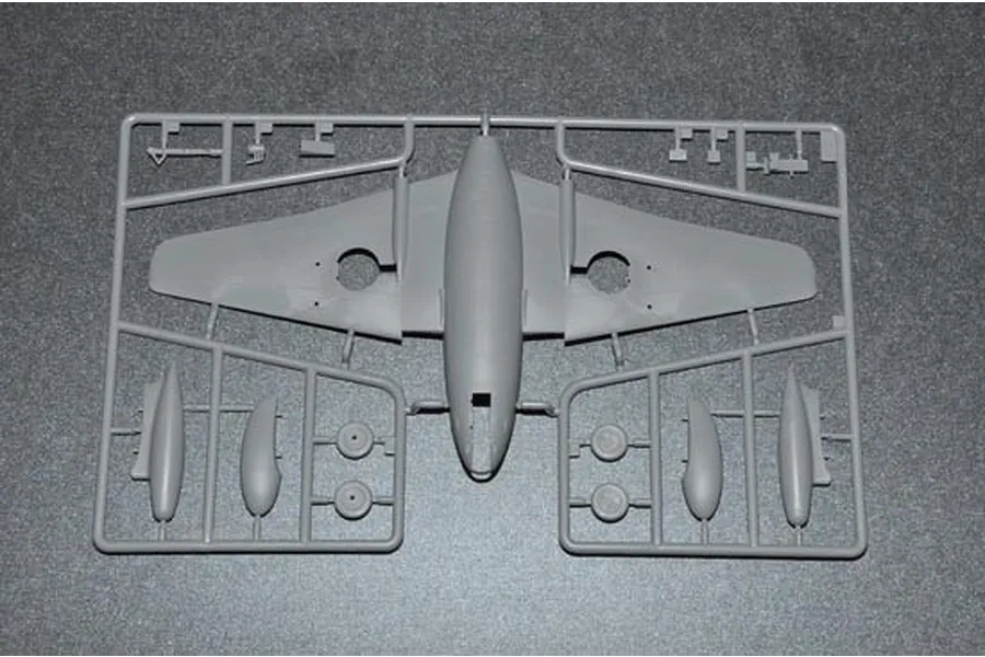 A grey plastic sprue containing the main fuselage and wing assembly for a 1/48 scale model aircraft kit.