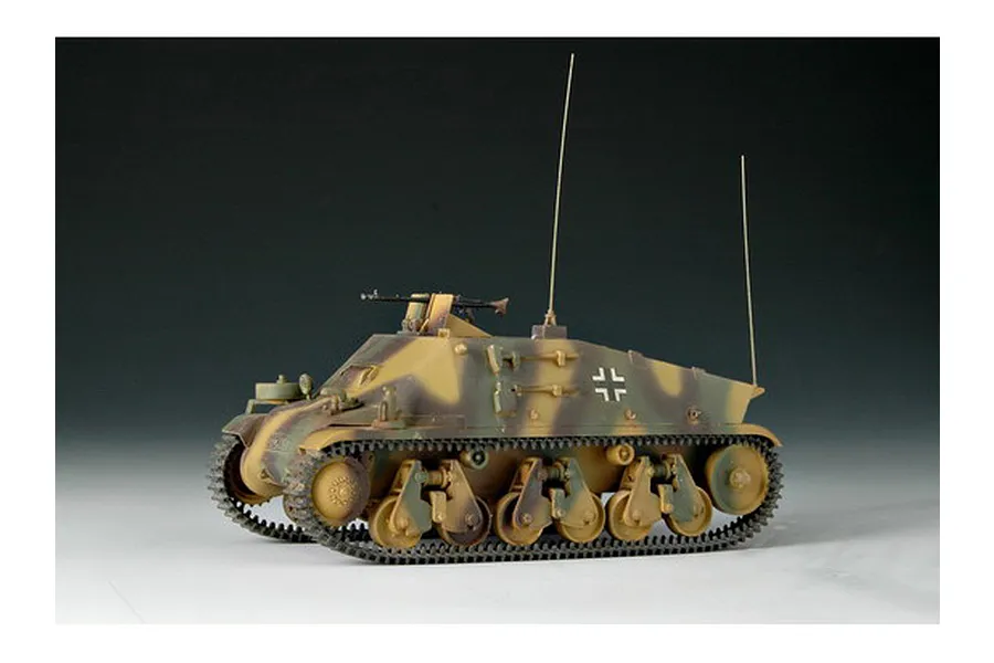 A 1/35 scale plastic model of a German Artillery Observation 38h vehicle, featuring a camouflage paint scheme and two tall radio antennas.