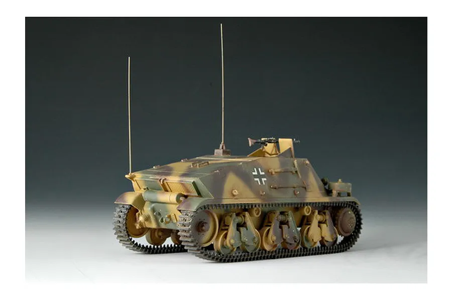 A 1/35 scale plastic model of a German Artillery Observation 38h vehicle, featuring a camouflage paint scheme and two tall radio antennas.