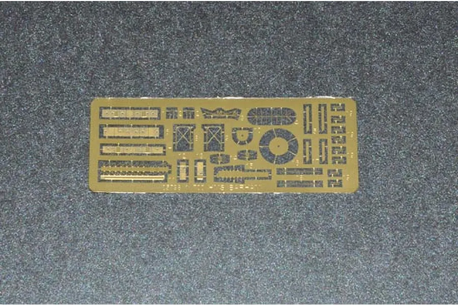 A photo-etched brass fret for a 1/700 scale HMS Barham model kit, featuring various small ship parts on a dark grey textured surface.