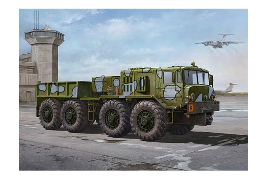 Box art illustration of a green and grey camouflaged KZKT-537L airfield truck parked on an airfield with an air traffic control tower in the background.