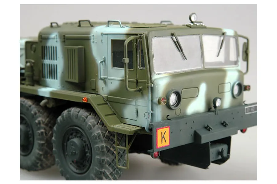 A detailed scale model of a KZKT-537L military airfield truck, featuring a green and light grey camouflage paint scheme and rugged off-road tires.