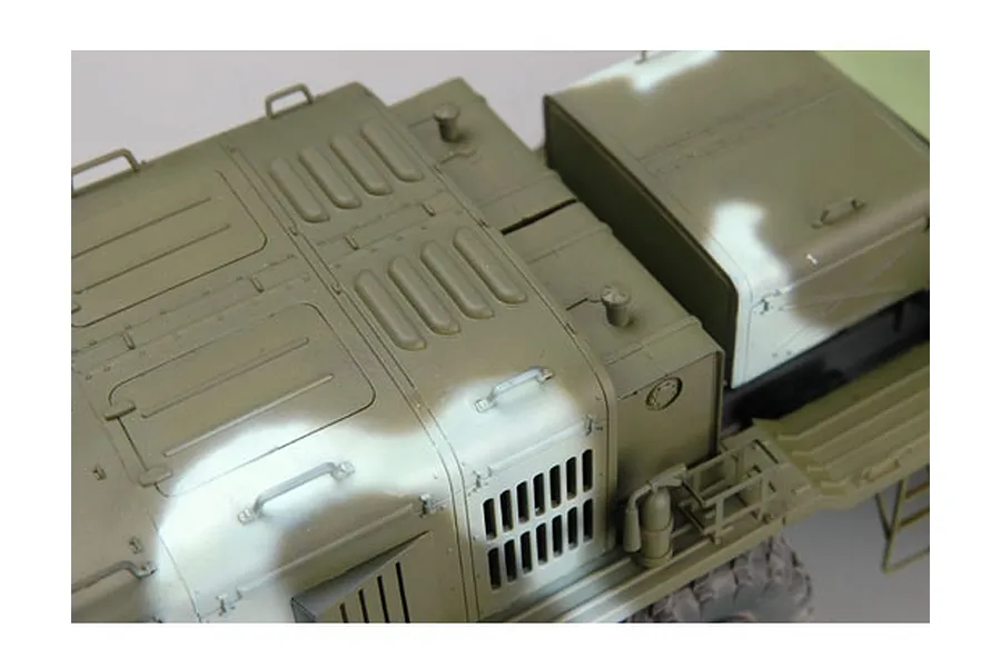 High-angle close-up of a 1/35 scale KZKT-537L military truck model kit, showing detailed olive green camouflage bodywork and engine deck.