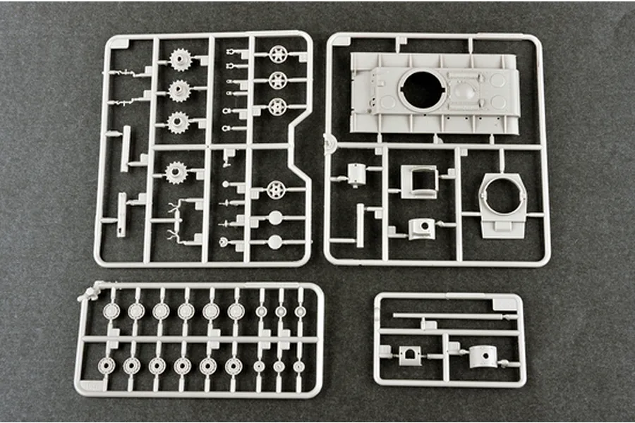 Four grey plastic model kit sprues containing tank parts for a 1/72 scale KV-2 model, laid out on a dark grey surface.