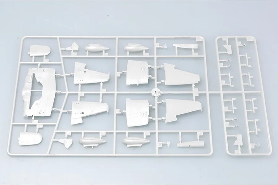 A grey plastic model aircraft sprue containing various wing and fuselage components for a 1/72 scale model kit.