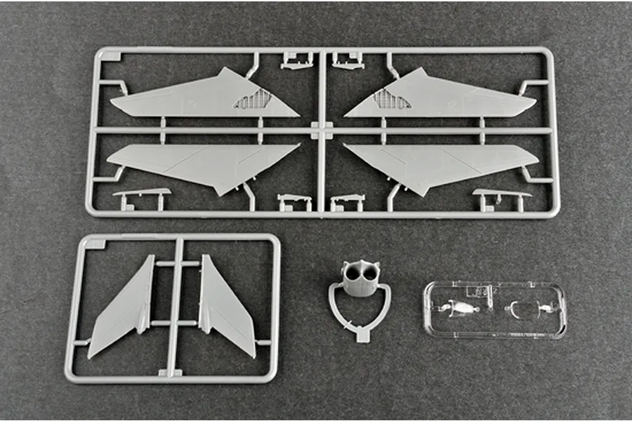 Plastic model kit sprues for a 1/72 scale Nanchang Q-5C aircraft, including wings, tail sections, and a clear canopy part.