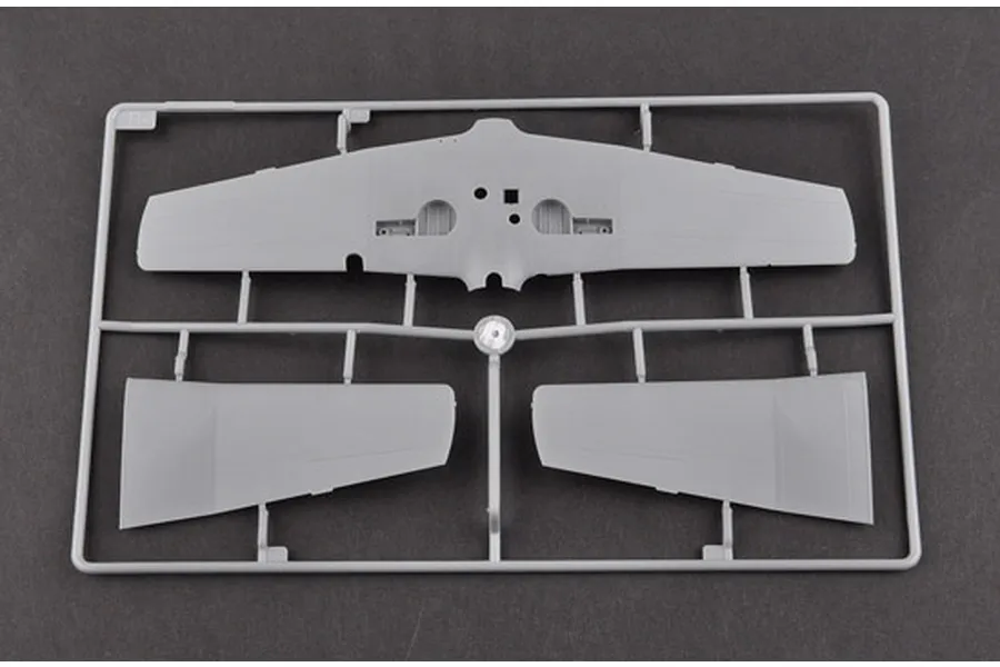 A grey plastic sprue containing model aircraft wing parts for a 1/48 scale Nanchang CJ-6 kit.