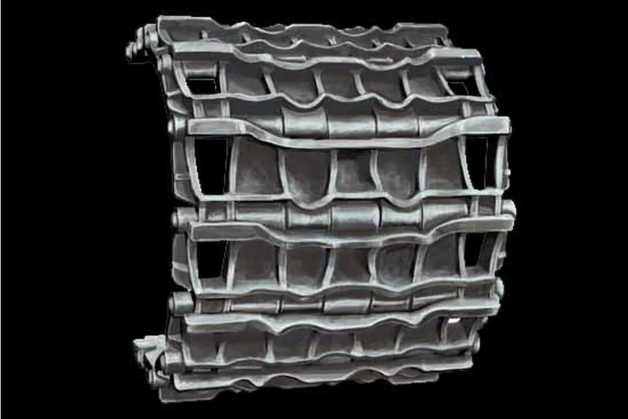 A section of assembled 1/35 scale plastic tank tracks with a metallic grey finish against a black background.